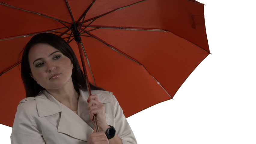 Chilled woman under red umbrella adjusting her coat waiting for taxi or a bus at bus stop. 4k footage PNG with alpha channel