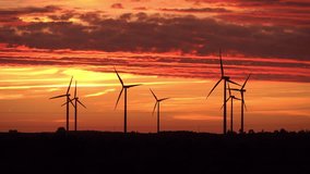 High quality video of windmills at the sunset in 4K