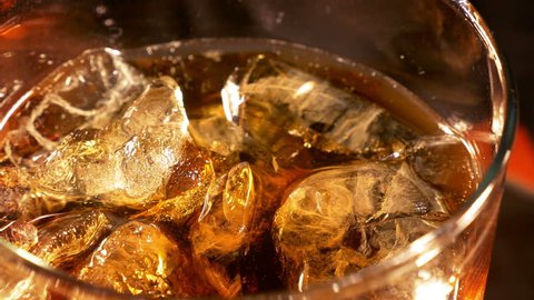 Three high quality videos of cold cola with bubbles in 4K