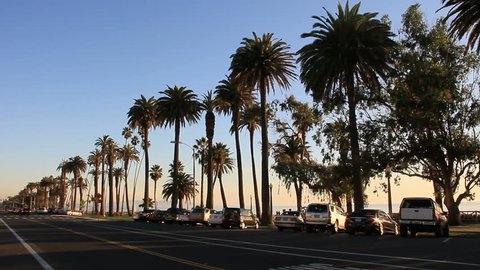 SANTA MONICA - CIRCA 2011: Traffic and activity at sunset hour along palm tree-lined Ocean Blvd circa 2011 in Santa Monica, CA.