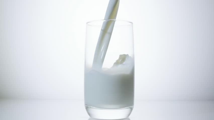 SLOW MOTION: Pouring milk in the glass, 240 fps. Royalty-Free Stock Footage #24322880