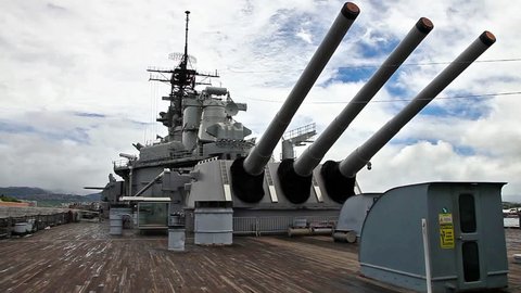 three big canons and main tower in prow of USS Missouri BB-63 battleship at Pearl Harbor base in Honolulu Hawaii, Oahu United States. Commissioned in June 1944 for the World War II and following wars.