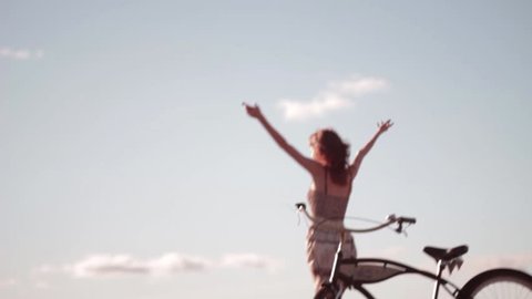 Flying around girl with bike Stock Video