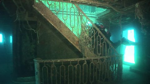 scuba diver exploring ship wreck underwater shipwreck