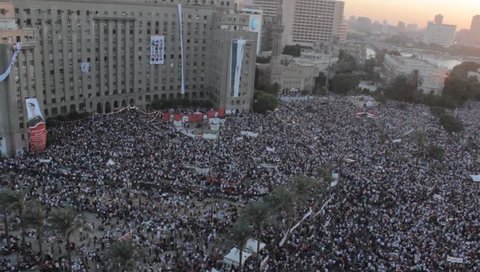 CAIRO, EGYPT - July 26: Millions of protesters in the tahrir square in response to the invitation of president abdel fattah el-sisi and helicopter flying over them.
July 26, 2013 in Cairo, Eg.