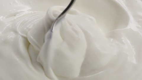 Slow motion of mixing yogurt with spoon, 180fps 
