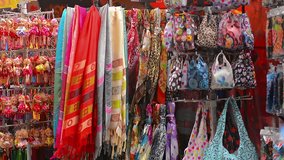 Clothes. bags. souvenirs and toys sale at a street vendor's stall in Singapore. Video FullHD 1080p