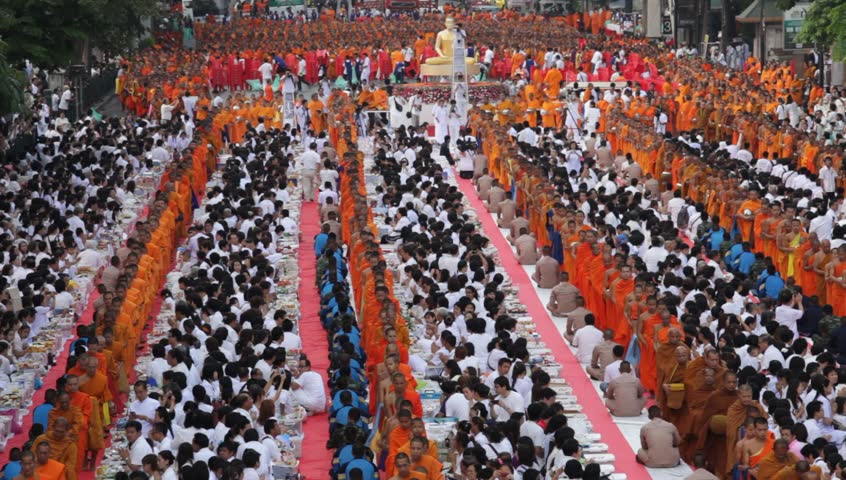 BANGKOK - MARCH 18: Monks are participating in a Mass Alms Giving of 12,600