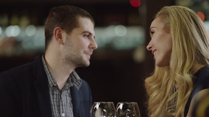 Lovers talking and drinking red wine in restaurant closely | Shutterstock HD Video #24342794