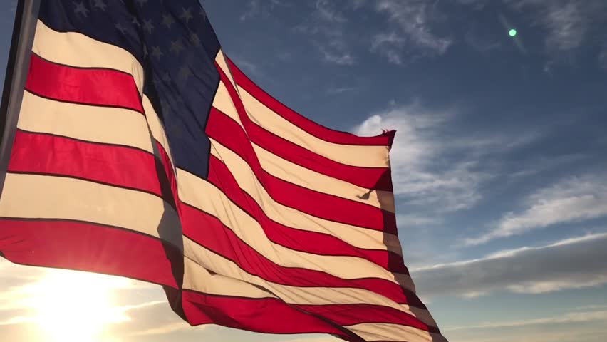 american flag flying wind sunrise slow Stok Videosu (%100 Telifsiz) 2434351...