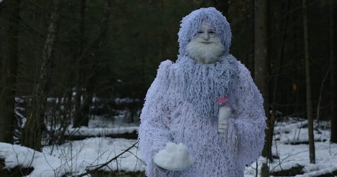Yeti fairy tale character in winter forest. Outdoor fantasy 4K footage.