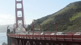 Timelapse of a lot of cars, on the Golden gate bridge, on a sunny november day, in San Fransisco, California, United states of america.