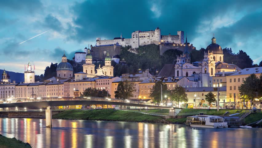 Salzburg skyline in the evening, Austria (Static image with animated sky and water)
