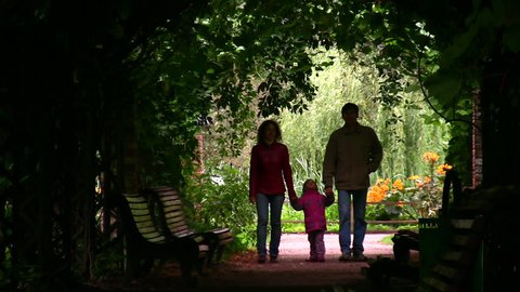 family silhouette in plant tunnel 