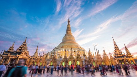 Shwedagon Pagoda, time lapse view of famous Buddhist landmark at sunset in Yangon, Myanmar (Burma).
