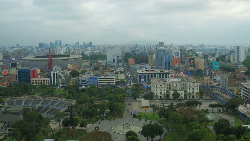 Lima Peru Aerial v60 Flying low over Park of the Exposition panning with cityscape views. 12/15
