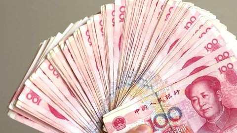 Waving With Chinese Money in Front of the Camera - 100 Yuan Banknotes (Total of 10.000 RMB)