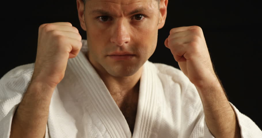 Man practicing karate in fitness studio