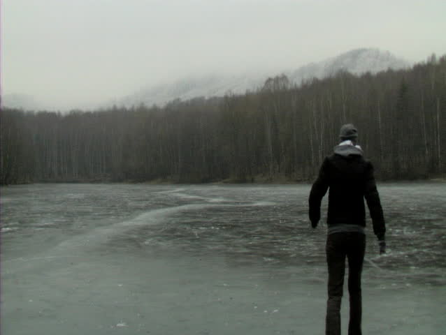 USTI NAD LABEM, CZECH REPUBLIC - FEBRUARY 28: Woman walking on a frozen lake in