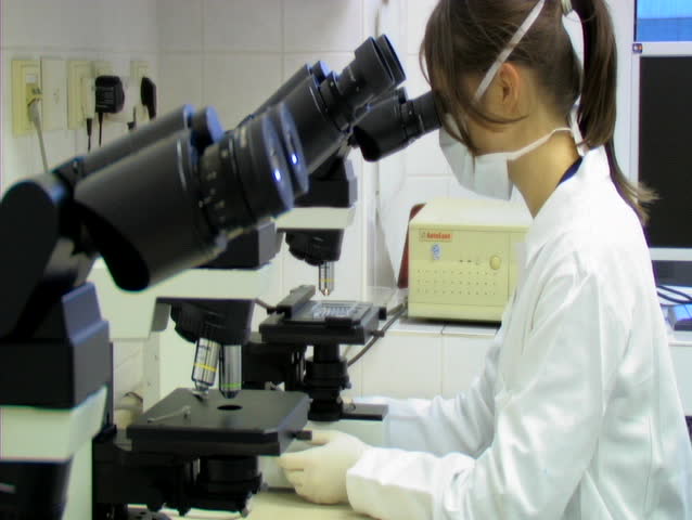 PRAGUE - APRIL 11: Doctor uses microscope to analyze blood sample. April 11th,