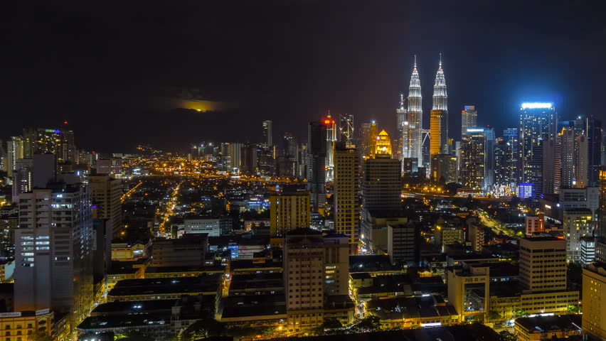 Time lapse: Beautiful and clear night view with of the Kuala Lumpur skyline with moonrise 