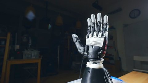Bionic arm printed on 3D printer. Futuristic technology concept.