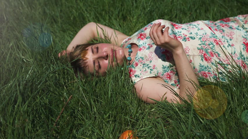 woman laying in grass