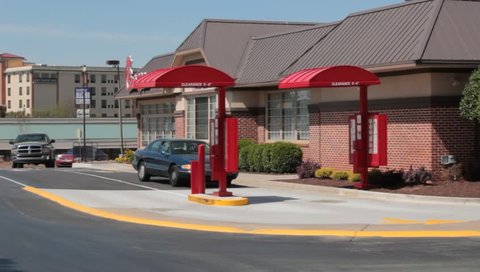 Stockbridge, GA. Circa 2015: A Car Drives up to the Drive Thru at a Chick-Fil-A Fast Ffood Restaurant