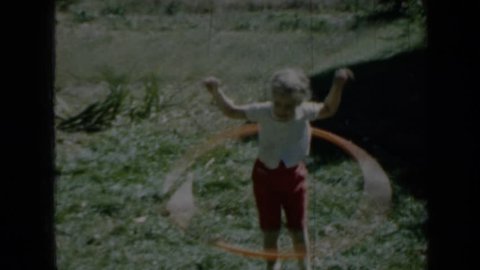 MINNESOTA 1958: child hula-hooping.