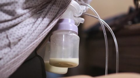 Mother pumped breast milk from her breast