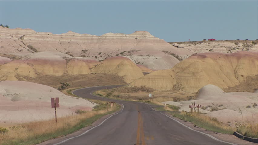 View of curved road in Badlands National Park United States