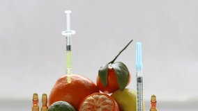 syringes, serum vitamin C, citrus fruits on a light background - Powered by Shutterstock - Get 15% off with code: PIKWIZARD15