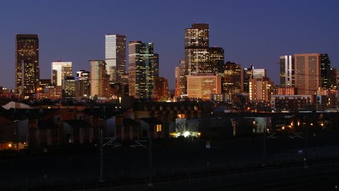 Beautiful view of the Downtown Denver skyline. Night to day timelapse. Full sunrise, from darkness to bright sun. 4K UHD.