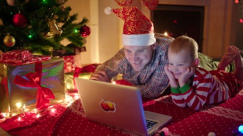 Father and son chatting online on Christmas Eve
