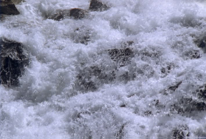 Close view of white-water rapids plunging over rocks