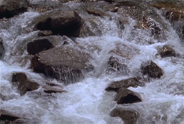 Close view of white water rapids and rocks