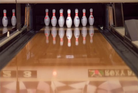 Close-up of a bowling ball making a strike