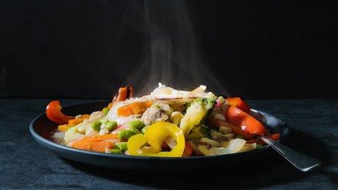 hot seafood rice with smoke in motion Cinemagraph