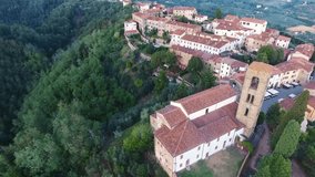 Aerial shot of a beautiful small medieval town on the hill in Tuscany, Italy, 4K