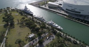 MIAMI, USA - MARCH 1, 2017: Aerial drone video of luxury yachts docked at Museum Park Downtown Miami. 
