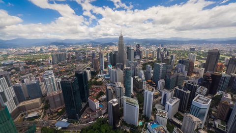 Aerial view of the Kuala Lumpur city skyline with busy streets of Kuala Lumpur, Malaysia on a blue skies, Ultra HD, 4K resolution