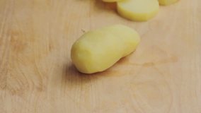 Cooked potatoes being sliced