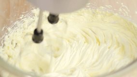 Butter being creamed with a mixer