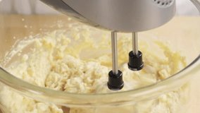 Biscuit dough being stirred with a hand mixer