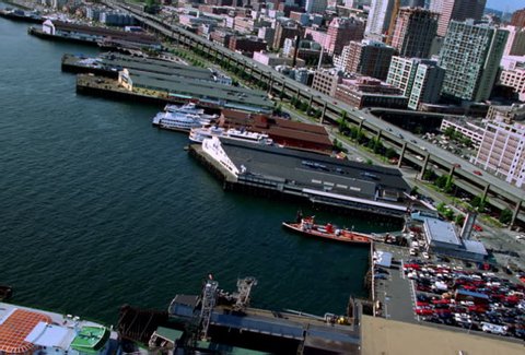 Flying over piers and docks of Seattle's waterfront. Shot in 2000.