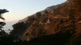 Zooming timelapse of sunset mountains, at a sunny november evening, in Big sur coast, California, United states of america.