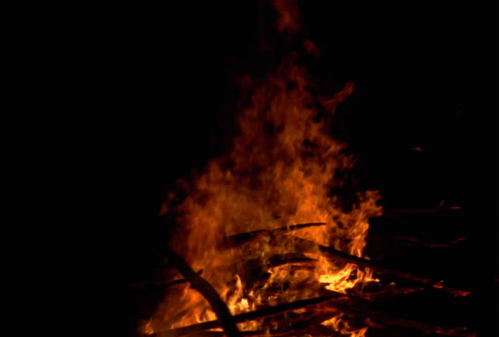 Blazing bonfire against black frame