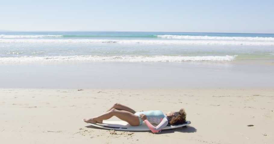Young woman on a surfboard
