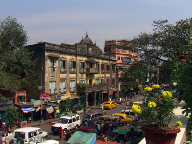 Left pan of street activity in Calcutta neighborhood