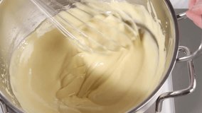 Whisking zabaglione until pale and fluffy
